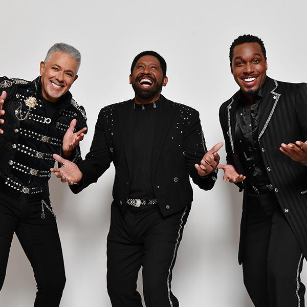 three members of commodores laughing